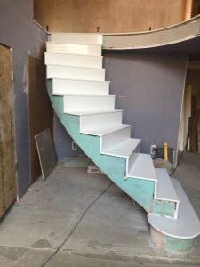 Plastering for a Large Curved Concrete Staircase